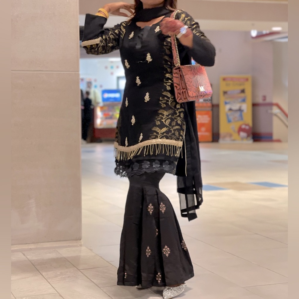 Black Gharara salwar kameez in size Medium.